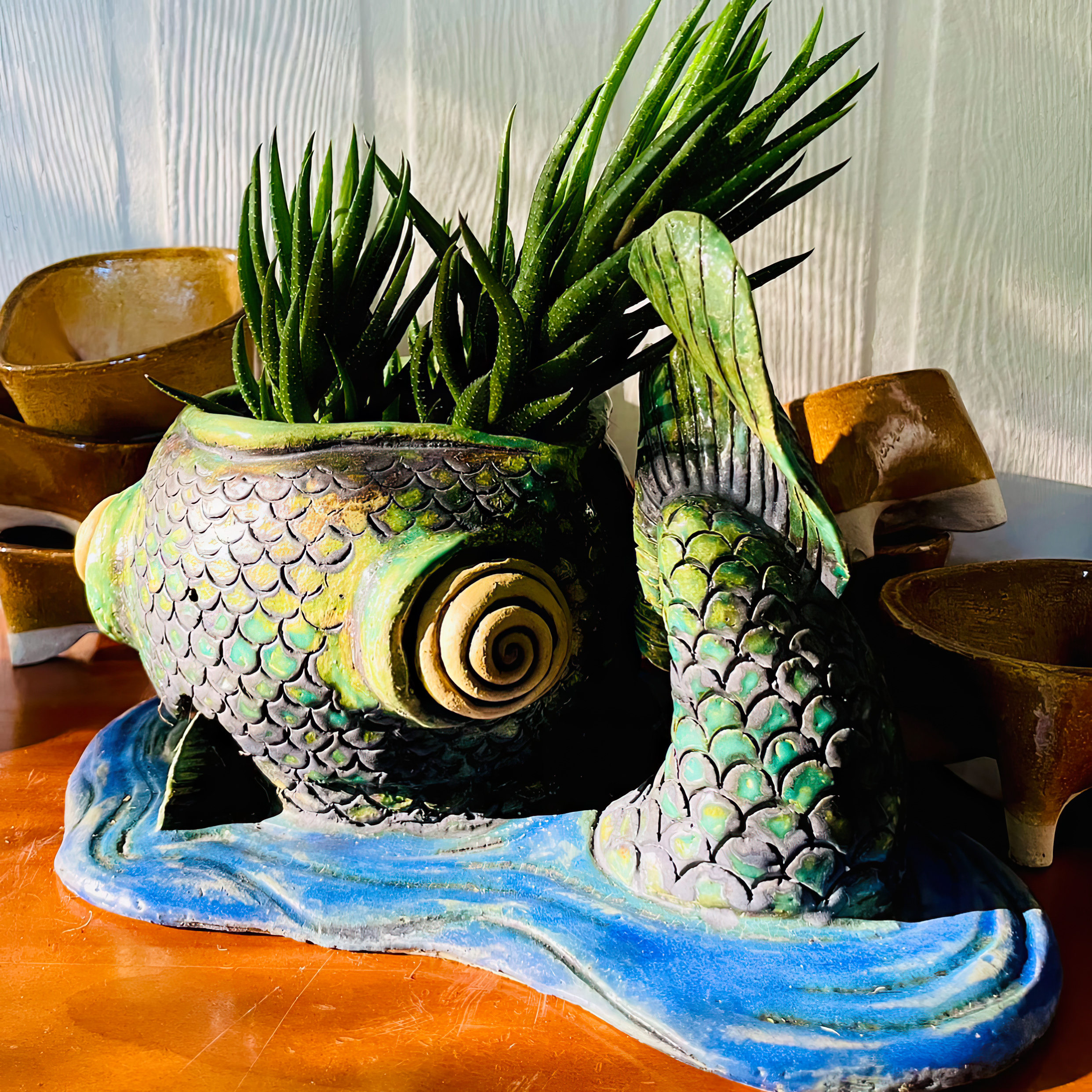 Ceramic fish pot with succulent in mouth - Amelia Ogg - Insperata Floruit